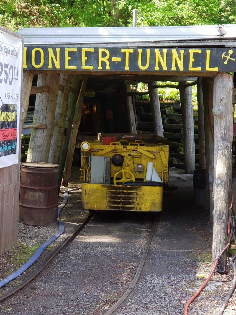 A Mountain With A Rail Car Waiting At Its Door