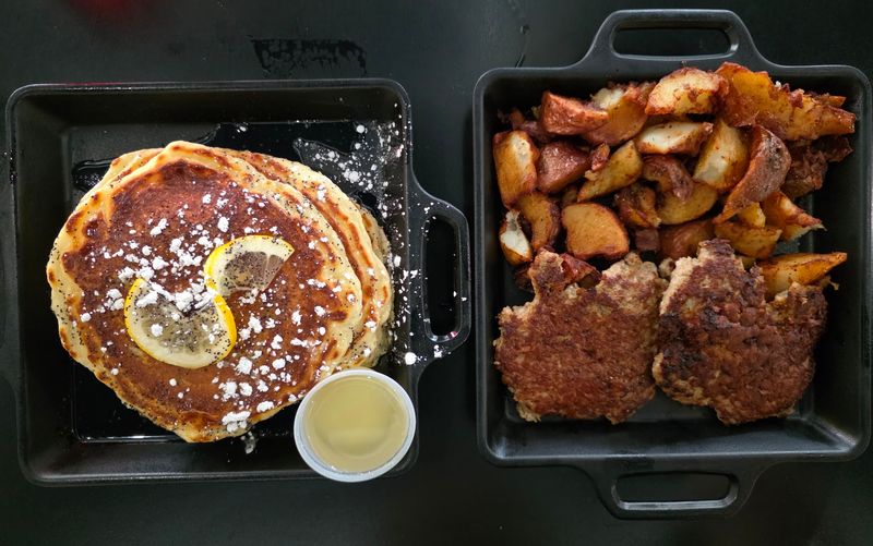 This Idaho Diner Has A Long Wait Most Mornings, And Regulars Have Been Lining Up For Years - Decor Hint Pancakes With Lemon, Berries, And A Little Attitude