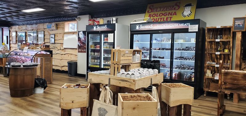 A Ring Toss Game Next to the Meat Case