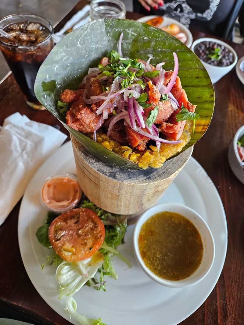 This Nebraska Puerto Rican Kitchen Serves Baked Pernil Alongside Arroz Mamposteao And Tostones - Decor Hint Mofongo Served in a Wooden Pilón