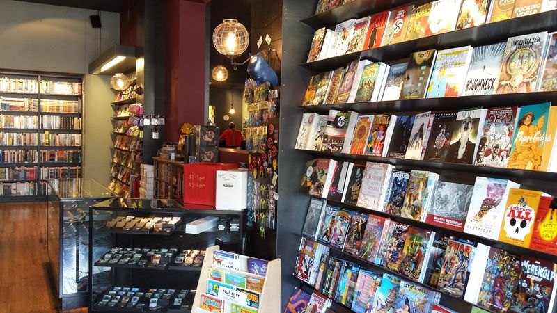 This Nebraska Comic Shop Brews Locally Roasted Coffee And Has Quiet Corners For Diving Into Comics - Decor Hint Muffins, Desserts, And A Menu With A Sense Of Humor