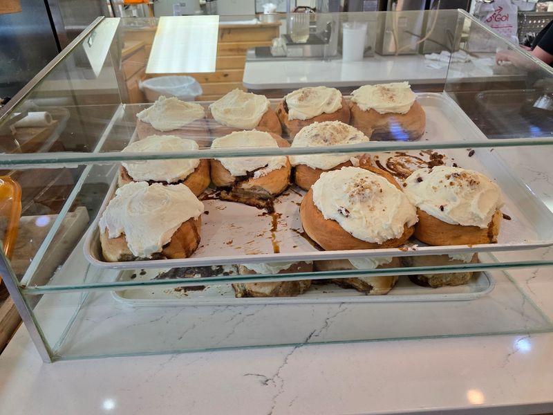 The Cinnamon Rolls At This Michigan Cafe Are So Massive They Barely Fit On The Plate - Decor Hint Set An Alarm For Sweetness