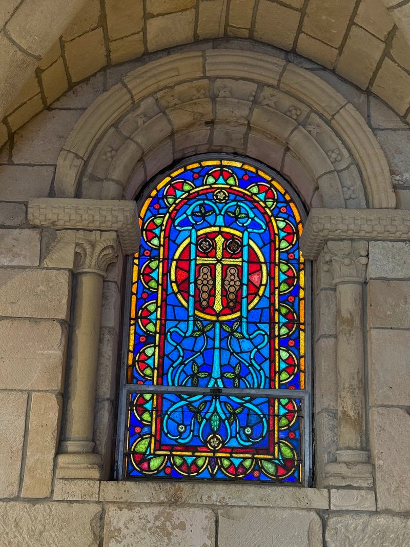Stone Arches, Stained Glass, And Walls That Carry A Whisper