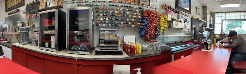 Counter Stools On One Side, Six Booths On The Other