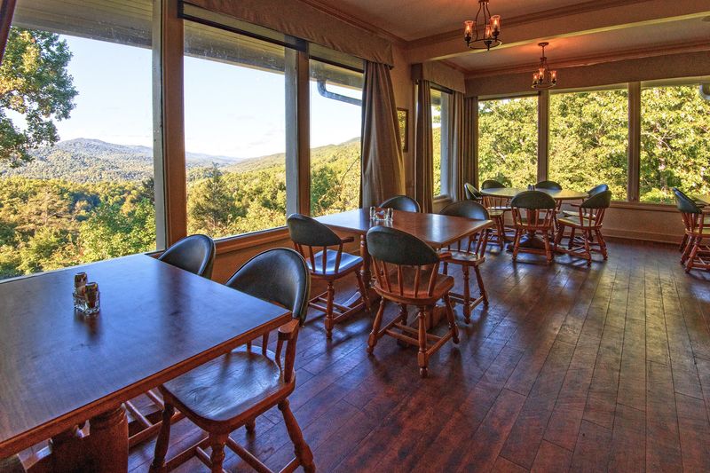 Dinner Tastes Better With Mist-Covered Peaks Outside