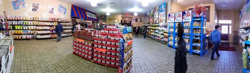 Bright Aisles, Fun Signage, And A Happy Crowd