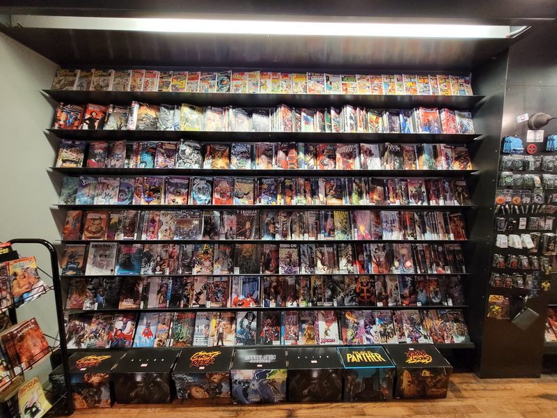 This Nebraska Comic Shop Brews Locally Roasted Coffee And Has Quiet Corners For Diving Into Comics - Decor Hint Shelves Packed With Comics And Hard-To-Find Back Issues