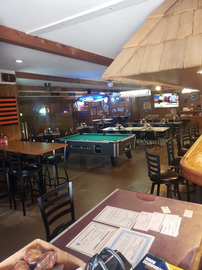 Pool Table, Busy Walls, And A Spotless Restroom