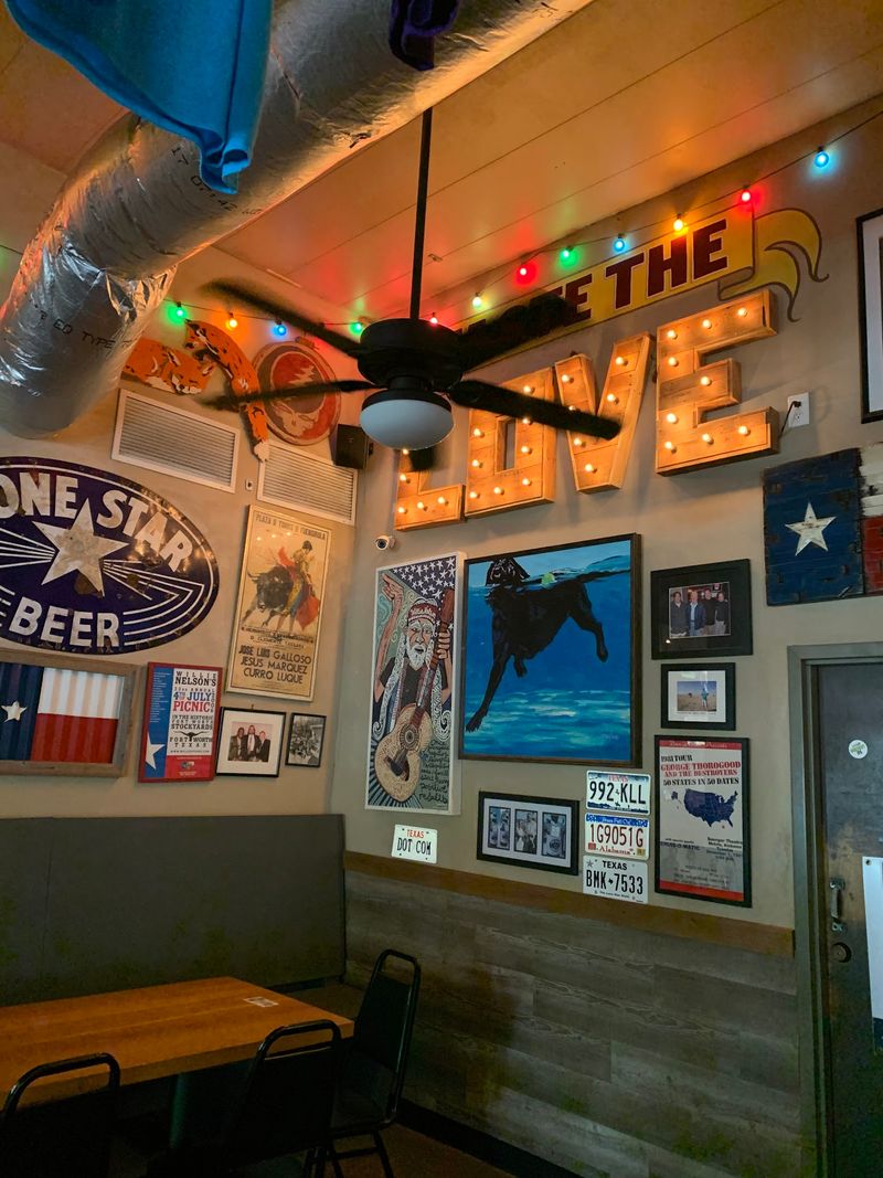 You Won't Believe How Affordable The Smoked Meat At This Georgia Restaurant Is - Decor Hint Fake Road Signs And Pig Art Set The Mood