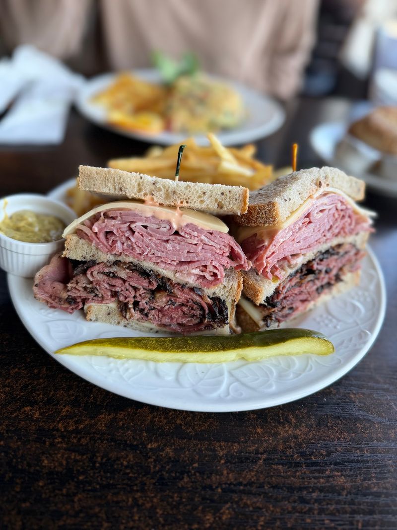 The Empire State Building Sandwich Stacks Corned Beef And Pastrami With Swiss Cheese And Russian Dressing