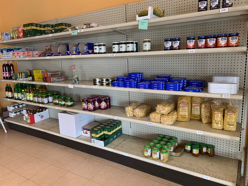 A Shelf Of European Groceries Near The Register