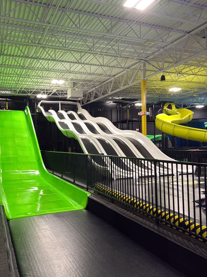 This New North Carolina Indoor Adventure Park Is Packed With Giant Slides And Air Courts - Decor Hint Four Lanes Means Somebody Is Losing A Race