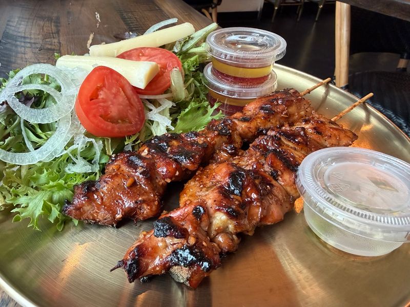 This Tiny Georgia Filipino Restaurant Earned A Michelin Award For Its Incredible Home-Style Cooking - Decor Hint Lumpia, Skewers, And A Grill That Means Business