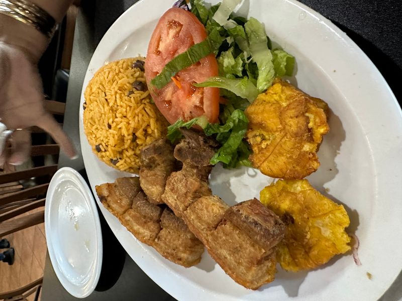 Crispy Fried Pork Comes With Rice, Beans And Plenty Of Plantains