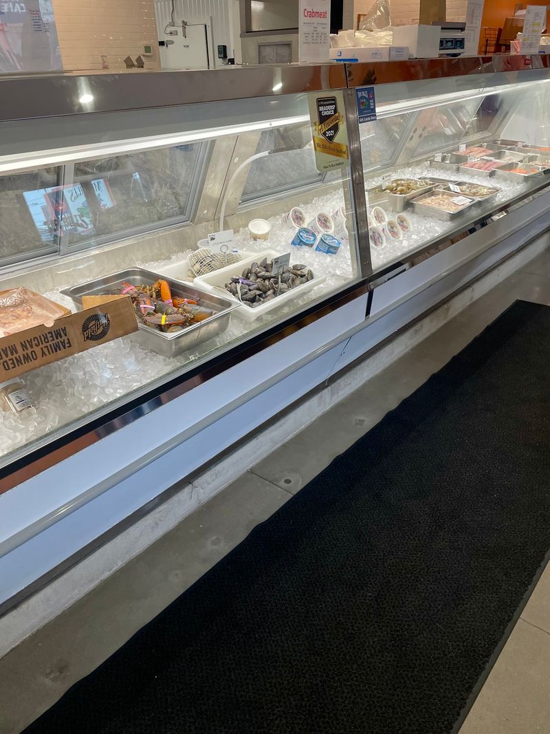 A Seafood Counter Sharing Walls With A Fish Market