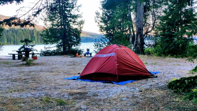 A Campground Parked At The Top Of A Very Big Lake