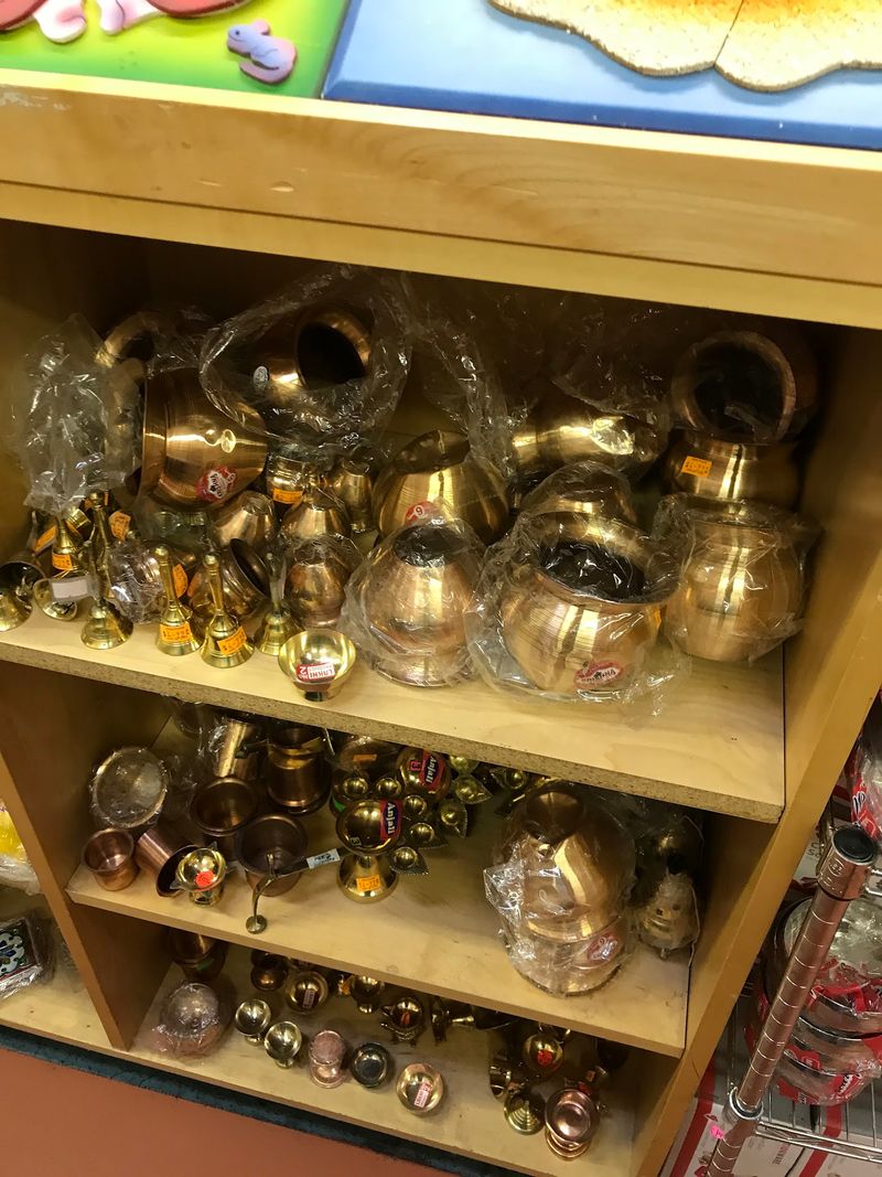 Incense, Copper Pots, And Pooja Supplies Share The Shelves