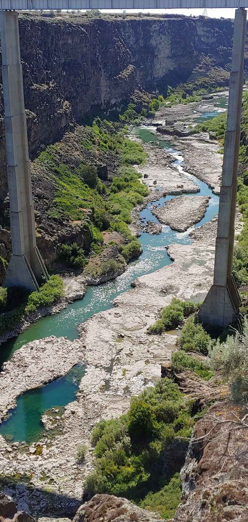 Green Rock And A Thirsty River Far Below
