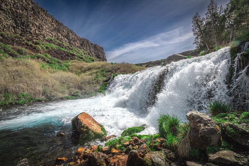 A Year-Round Waterfall Streaked In Blue And Emerald