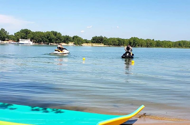 Boats, Kayaks, and a Line in the Water