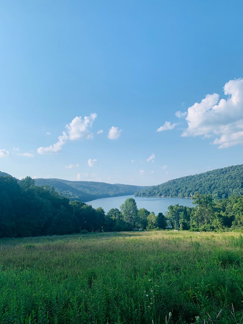Paddle Across The Water With Forested Hills All Around