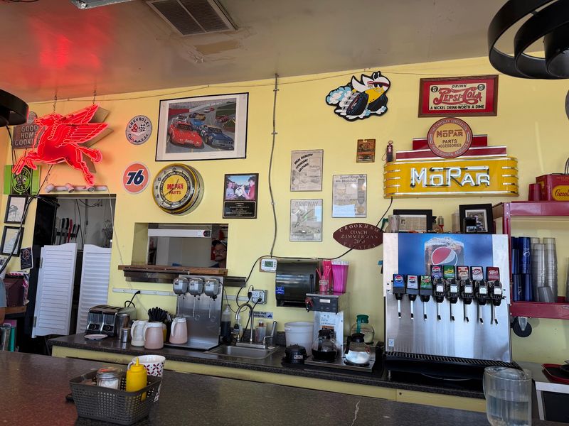 Old Gas Station Signs And Car Memorabilia Cover The Walls Of This Idaho Café Built Inside A Former Service Station